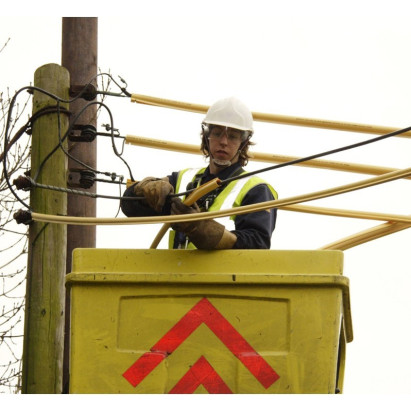 Overhead line shrouding manufactured from yellow U.V. resistant material